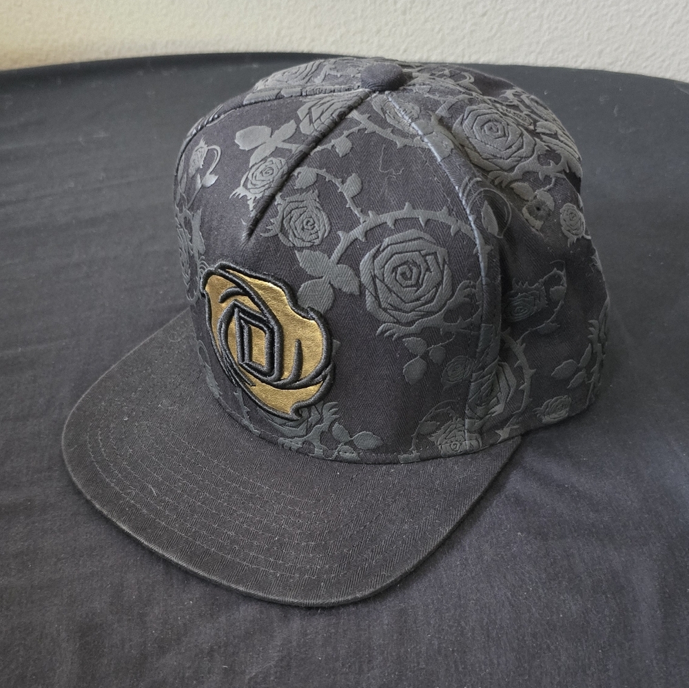 New Era Black Floral Snapback with Gold Emblem